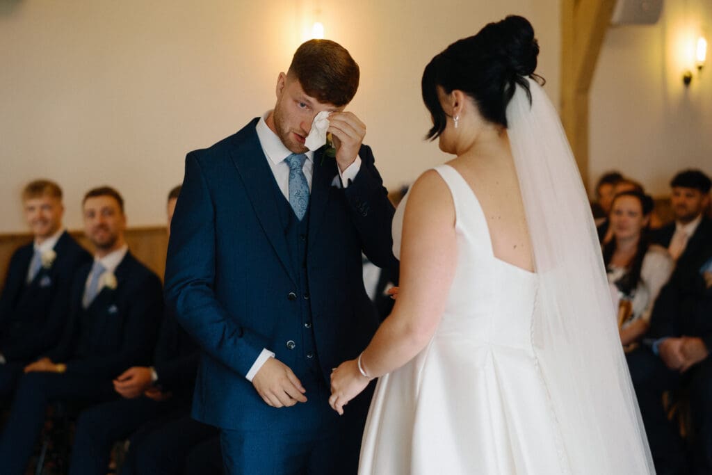 Groom wipes away a tear
