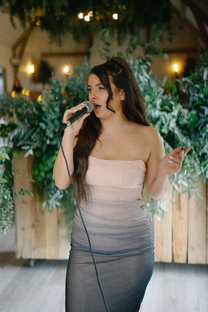 Olivia Mae singing at Lucy and Alex's River Barn Wedding