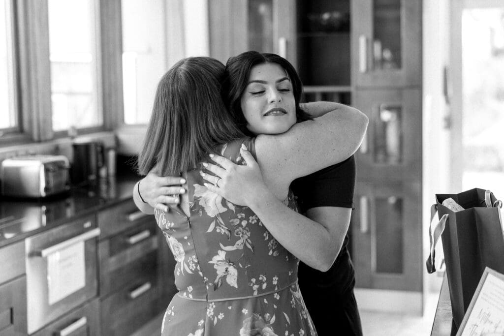 Lucy hugs her mother before her wedding at the River Barn, by Nessworthy Pictures