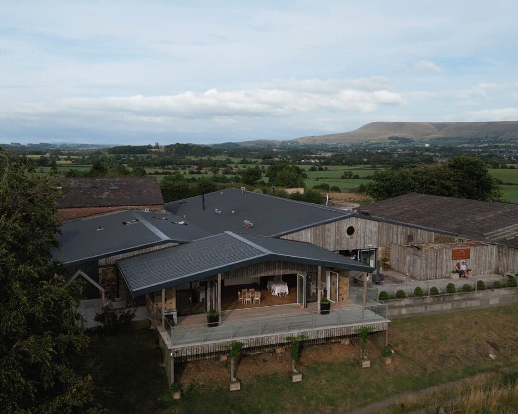 Still taken from drone footage showing Bashall Barn from above, captured by Nessworthy Pictures, Bashall Barn wedding videographer